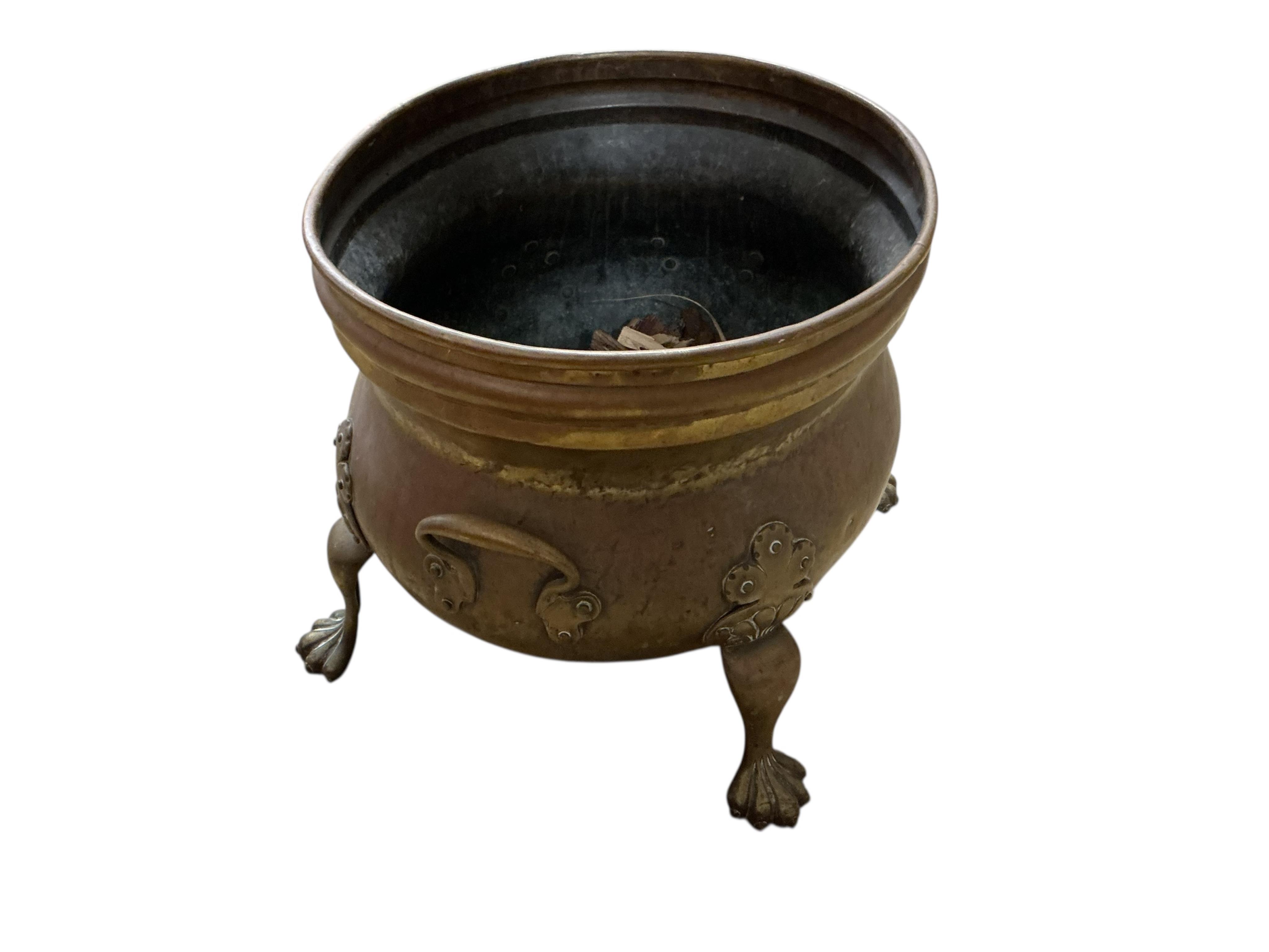 A Dutch style oval brass log bin, diameter 48cm, depth 39cm, height 37cm